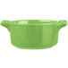 A lime green porcelain cocotte with handles.