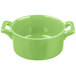 A green porcelain Bon Chef cocotte with handles on a white background.