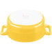 A yellow porcelain oval cocotte with a white background.
