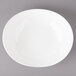 A white Bon Chef pasta bowl on a gray background.