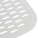 A close up of a white metal perforated pizza peel.