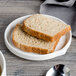 A slice of bread on a Bon Chef white porcelain bread and butter plate.