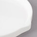 A close-up of a white Bon Chef porcelain bread and butter plate with stacked lines.
