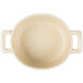 A white Bon Chef porcelain oval cocotte with handles.