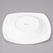 A white Bon Chef soft square porcelain plate.