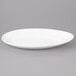 A white Bon Chef porcelain oval plate with a curved edge.