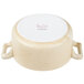 A white porcelain cocotte with handles.