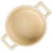 A beige Bon Chef porcelain cocotte with handles.