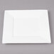 A white square Bon Chef bone china plate on a gray surface.