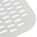 A close up of a metal square with a white handle and perforations.