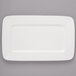 A white rectangular Bon Chef porcelain plate with thin black circles.