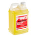 A jug of yellow liquid with a white lid.