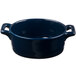 A cobalt blue porcelain oval cocotte with handles.