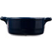 A cobalt blue porcelain oval cocotte with handles.