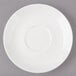 A white Bon Chef porcelain saucer with circles on the rim.