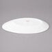 A white Bon Chef slanted oval porcelain plate.