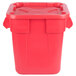 A red plastic Rubbermaid BRUTE trash can with a snap-lock lid.