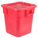A red Rubbermaid BRUTE plastic container with a lid.