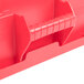 A red Rubbermaid BRUTE square trash can with a snap-lock lid.