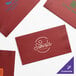 A red package of Choice 2-ply paper dinner napkins with white text.