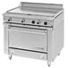 A stainless steel Garland commercial electric range with 2 all purpose top sections and knobs.