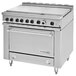 A stainless steel Garland commercial electric range with 6 boiler sections and storage.