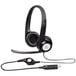 A Logitech black headset with a white circle on the earpiece and microphone.