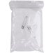 A plastic bag with a pair of white plastic safety pins.