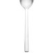 A Walco stainless steel dessert spoon with a white handle and silver spoon.