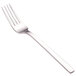 A close-up of a Walco stainless steel dinner fork with a silver handle.