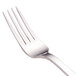 A close-up of a Walco stainless steel dinner fork with a silver handle.