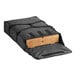 A black CaterGator Dash sheet pizza bag holding two pizza boxes.