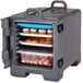 A Cambro charcoal gray front loading insulated tray and food pan carrier with food inside.