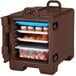 A dark brown Cambro food pan carrier filled with food.