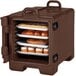 A dark brown Cambro carrier holding trays of pastries.