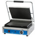 A Globe commercial Panini grill with blue and black details on a counter.