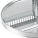 A Robot Coupe 3-disc set with metal circular discs and a metal handle.