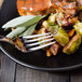 A plate of food with a Walco Star stainless steel table fork.
