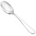 A close-up of a Walco stainless steel teaspoon with a silver handle.