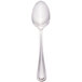 A Walco Pacific Rim stainless steel tablespoon with a white handle.