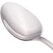 A close-up of a Walco Pacific Rim stainless steel serving spoon with a silver handle.