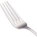 A close-up of a Walco Pacific Rim stainless steel dinner fork with a silver handle.