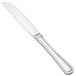 A close-up of a Walco Pacific Rim stainless steel butter knife with a solid silver handle.