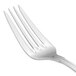 A close-up of a Walco Luxor salad fork with a white handle.