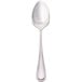 A Walco stainless steel dessert spoon with a silver handle on a white background.