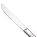 A close-up of a Walco stainless steel dinner knife with a silver handle.