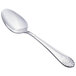 A close-up of a Walco stainless steel serving spoon with an Art Deco handle.