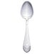 A Walco stainless steel serving spoon with an Art Deco design on the handle.