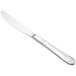 A close-up of a silver Walco Art Deco table knife with a design on the handle.