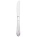 A silver Walco stainless steel table knife with a white handle.